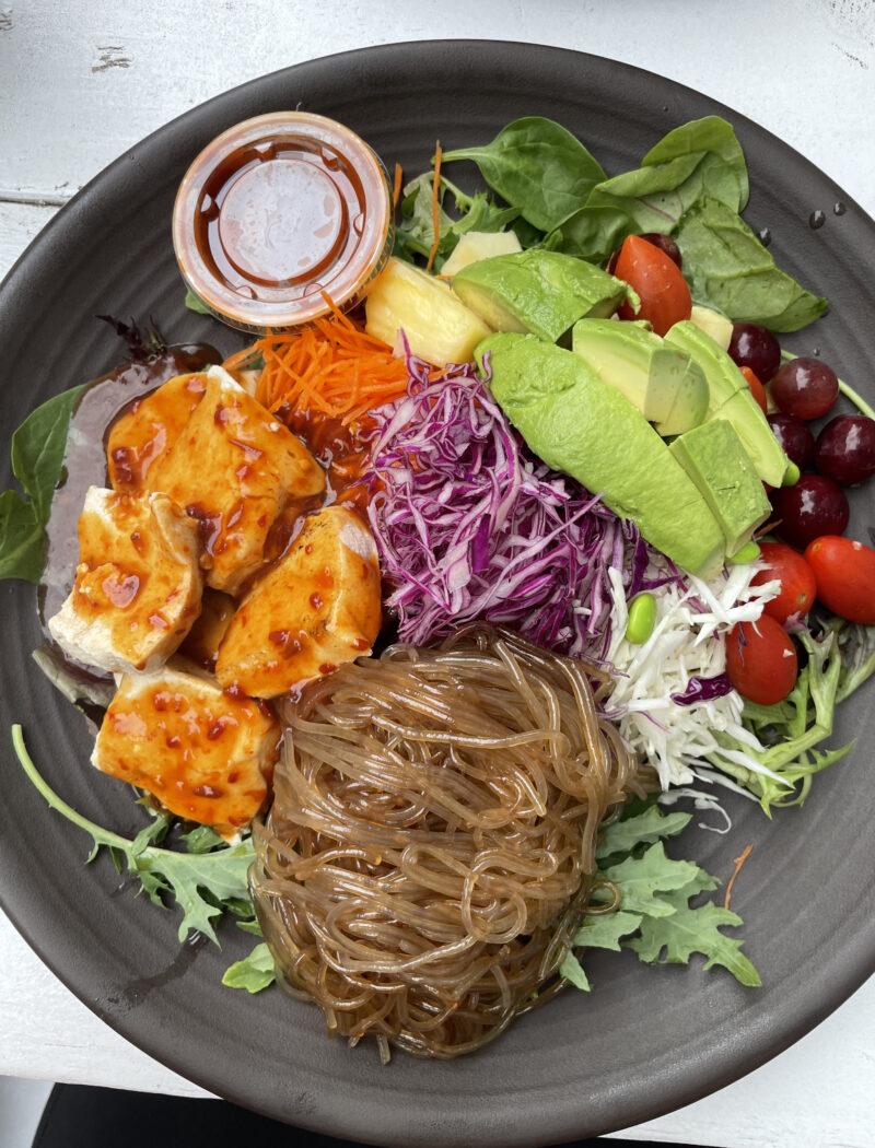 Image of Nancy's Sky Garden Spicy Tuna Rainbow Bowl, a healthy food option in Austin. The bowl is filled with fresh vegetables, sweet potato noodles and spicy tuna, making it a perfect meal for those looking for a nutritious and delicious meal in Austin.